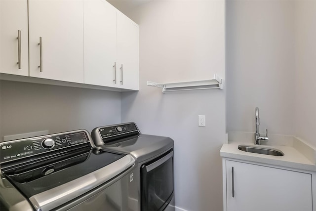 1906 Park St, Houston, TX 77019 - washroom with washing machine and clothes dryer and cabinet space
