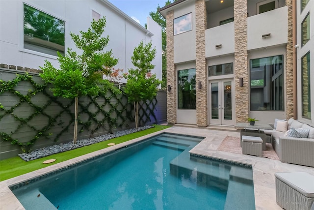 1906 Park St, Houston, TX 77019 - swimming pool with french doors, an outdoor living space, a fenced backyard, and a patio