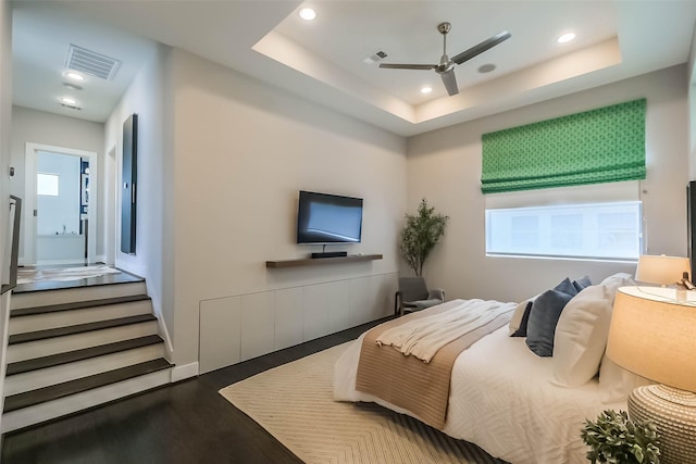 1906 Park St, Houston, TX 77019 - bedroom with wood finished floors, recessed lighting, a tray ceiling, and ceiling fan