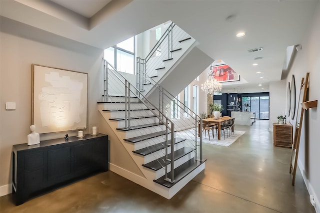 1906 Park St, Houston, TX 77019 - stairway with finished concrete flooring, a chandelier, and recessed lighting
