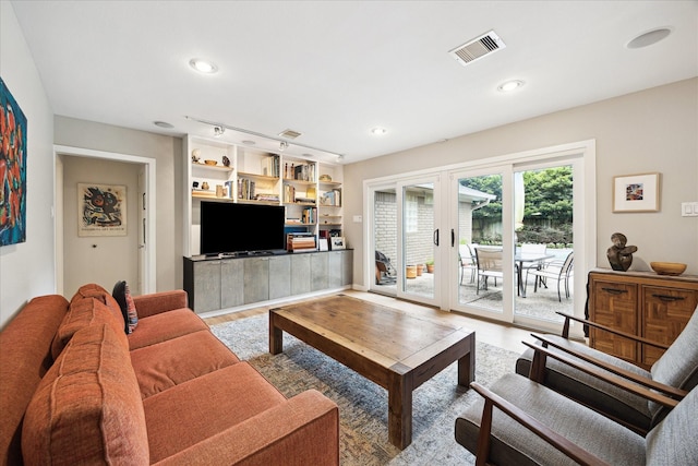 5171 Jason St, Houston, TX 77096 - living area featuring wood finished floors, french doors, and recessed lighting