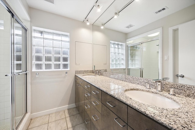 5171 Jason St, Houston, TX 77096 - full bathroom featuring double vanity, a stall shower, and tile patterned flooring