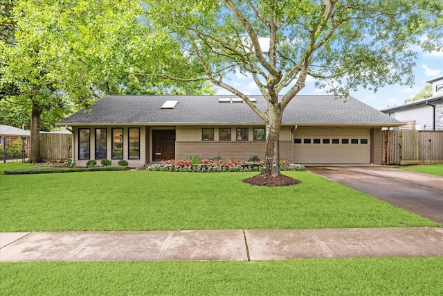 5171 Jason St, Houston, TX 77096 - mid-century home featuring a garage, concrete driveway, brick siding, and roof with shingles