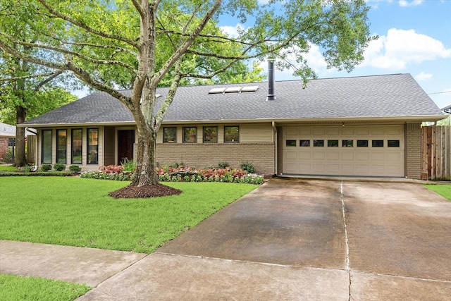 5171 Jason St, Houston, TX 77096 - view of front of home featuring brick siding, a garage, driveway, and a shingled roof