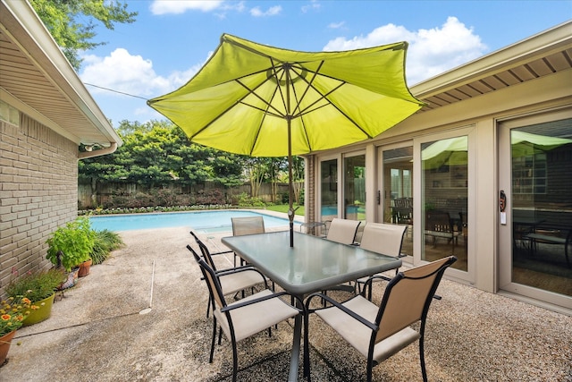 5171 Jason St, Houston, TX 77096 - fenced backyard featuring a patio and outdoor dining space