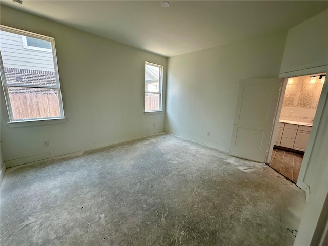 13085 Brookwood Bend Ln, Conroe, TX 77302 - unfurnished bedroom featuring baseboards and ensuite bathroom