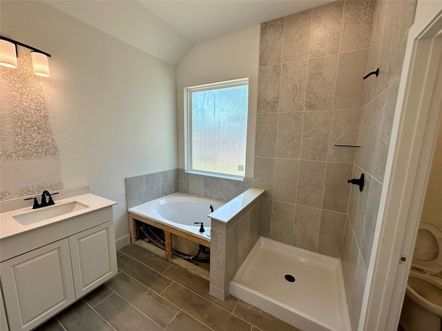 13085 Brookwood Bend Ln, Conroe, TX 77302 - full bathroom with a garden tub, vaulted ceiling, vanity, a tile shower, and tile patterned flooring