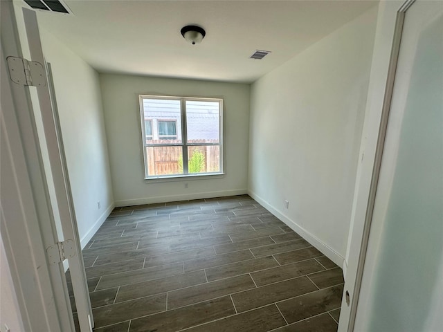 13085 Brookwood Bend Ln, Conroe, TX 77302 - spare room with wood finish floors and baseboards