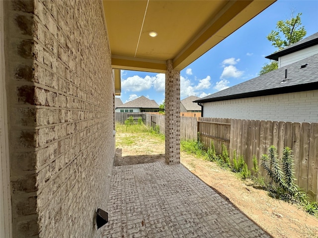 13085 Brookwood Bend Ln, Conroe, TX 77302 - fenced backyard featuring a patio