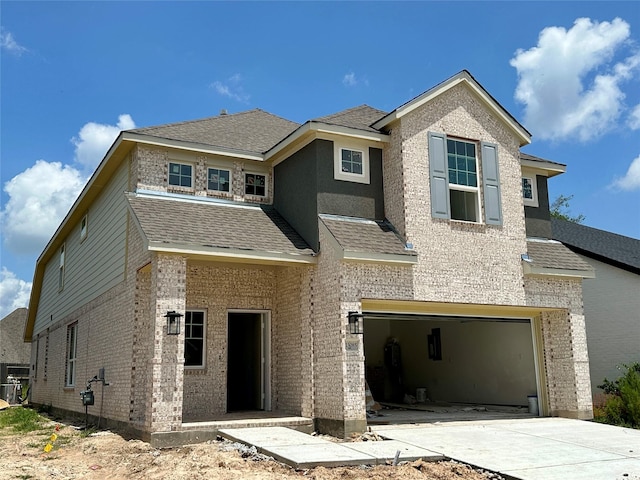 13085 Brookwood Bend Ln, Conroe, TX 77302 - view of front facade featuring brick siding, an attached garage, concrete driveway, and a shingled roof
