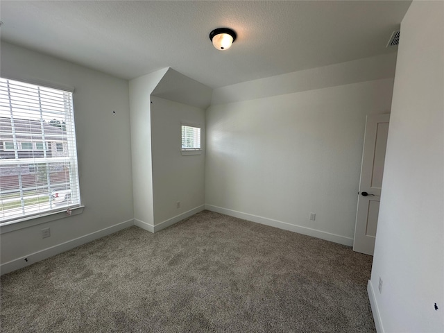 13085 Brookwood Bend Ln, Conroe, TX 77302 - unfurnished room featuring plenty of natural light and carpet flooring