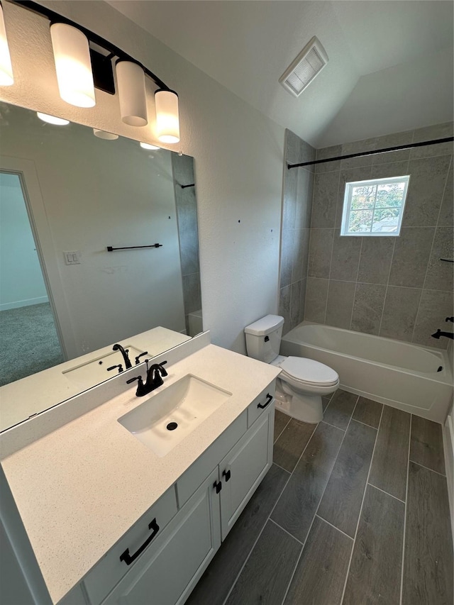 13085 Brookwood Bend Ln, Conroe, TX 77302 - full bath featuring vanity, wood finish floors, shower / tub combination, and vaulted ceiling