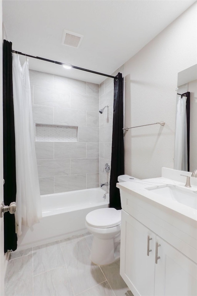 9106 Gustine Ln, Houston, TX 77031 - bathroom with vanity, shower / bath combo, and marble look tile flooring