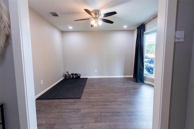 9106 Gustine Ln, Houston, TX 77031 - empty room featuring ceiling fan, dark wood-type flooring, and recessed lighting
