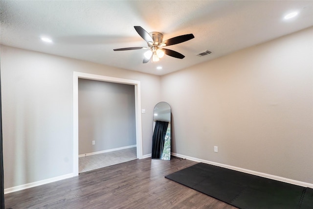 9106 Gustine Ln, Houston, TX 77031 - spare room with ceiling fan, dark wood-style flooring, and recessed lighting