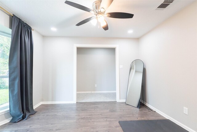 9106 Gustine Ln, Houston, TX 77031 - unfurnished room with plenty of natural light, ceiling fan, and wood finished floors