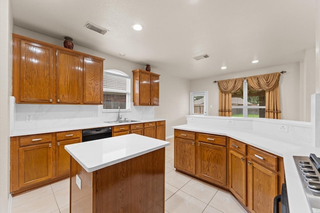 11223 Cactus Valley Ct, Houston, TX 77089 - kitchen featuring dishwasher, light tile patterned floors, light countertops, healthy amount of natural light, and recessed lighting