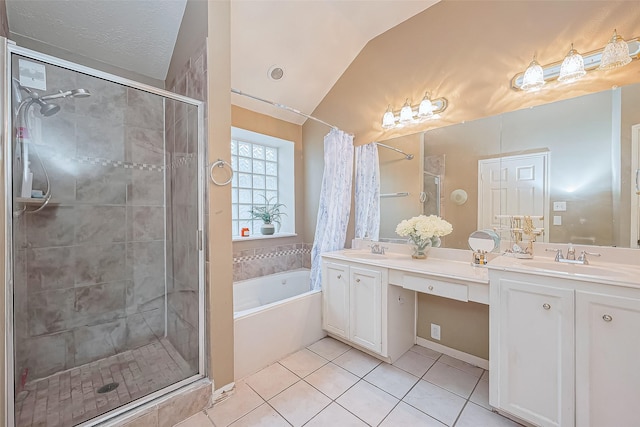 10323 Emerald Pine Dr, Houston, TX 77070 - bathroom featuring a stall shower, double vanity, a garden tub, tile patterned flooring, and vaulted ceiling
