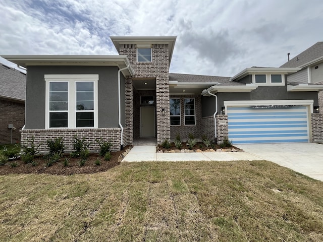 12814 Forest Garden Ct, Conroe, TX 77302 - view of front of property featuring driveway, a front lawn, stucco siding, brick siding, and a garage