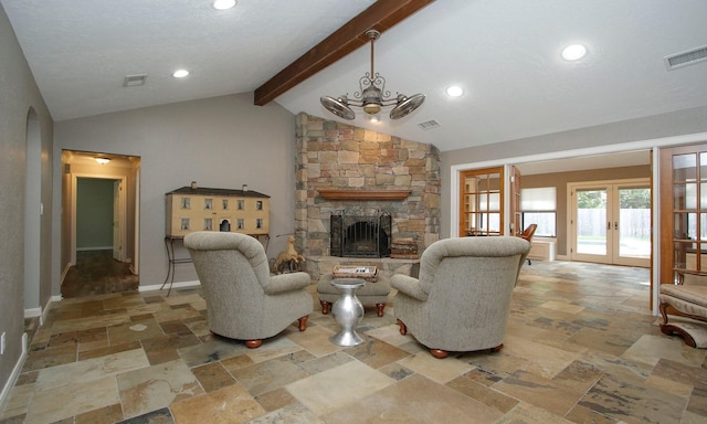 2102 Candy St, Pinehurst, TX 77362 - living area featuring french doors, stone tile flooring, a fireplace, arched walkways, and recessed lighting