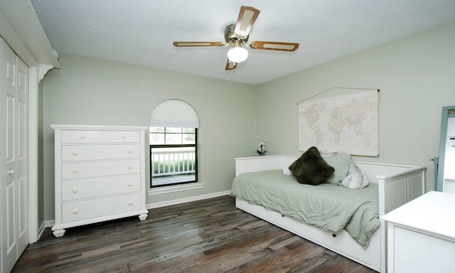 2102 Candy St, Pinehurst, TX 77362 - bedroom with dark wood-style flooring and ceiling fan