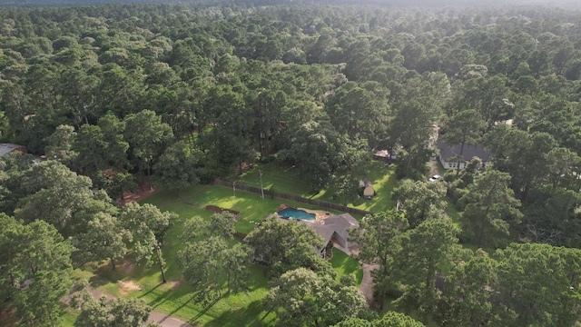 2102 Candy St, Pinehurst, TX 77362 - aerial overview of property's location featuring a heavily wooded area