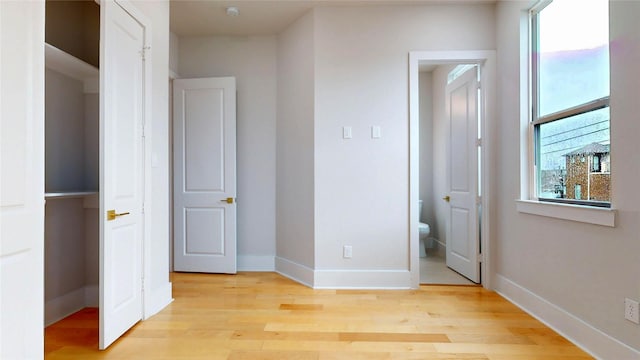 2611 Sherwin St, Houston, TX 77007 - unfurnished bedroom with light wood-type flooring and ensuite bathroom
