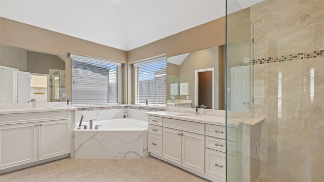 9138 Shango Ln, Houston, TX 77095 - full bath with a bath, two vanities, a shower stall, lofted ceiling, and tile patterned flooring