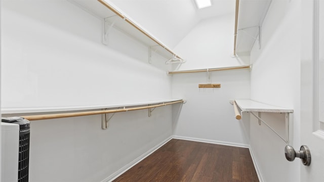 9138 Shango Ln, Houston, TX 77095 - walk in closet with dark wood-style flooring