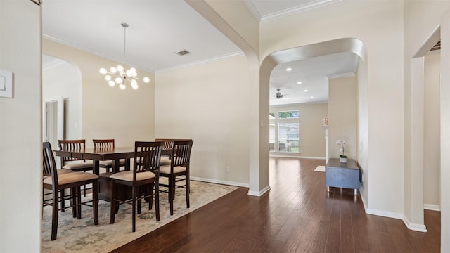 9138 Shango Ln, Houston, TX 77095 - dining area featuring arched walkways, hardwood / wood-style flooring, ornamental molding, a ceiling fan, and a chandelier
