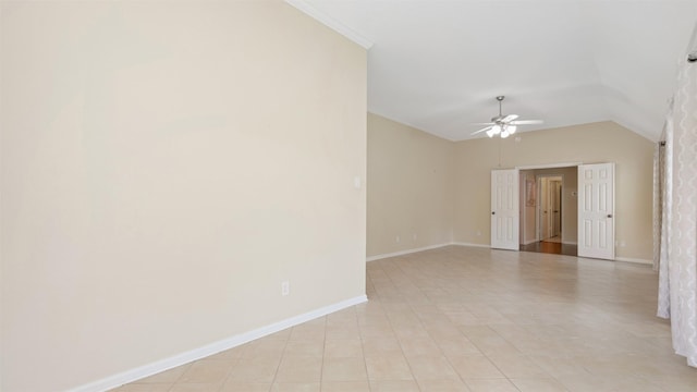 9138 Shango Ln, Houston, TX 77095 - spare room with a ceiling fan, vaulted ceiling, ornamental molding, and light tile patterned floors