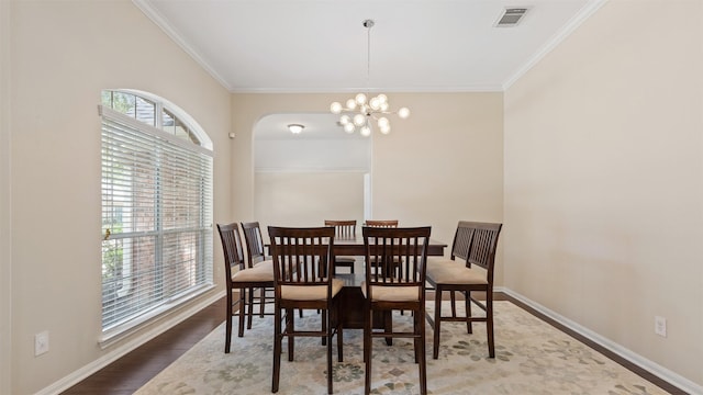 9138 Shango Ln, Houston, TX 77095 - dining space featuring crown molding, a chandelier, and wood finished floors