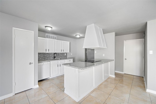 4406 Kacee Dr, Houston, TX 77084 - kitchen with dishwasher, white cabinets, a peninsula, and light tile patterned floors