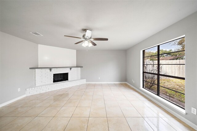 4406 Kacee Dr, Houston, TX 77084 - unfurnished living room featuring a ceiling fan, light tile patterned floors, and a fireplace