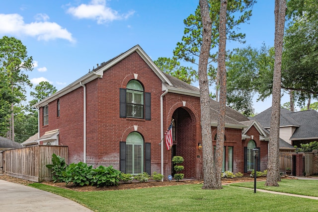12927 Finch Brook Dr, Cypress, TX 77429 - traditional-style house featuring brick siding and roof with shingles