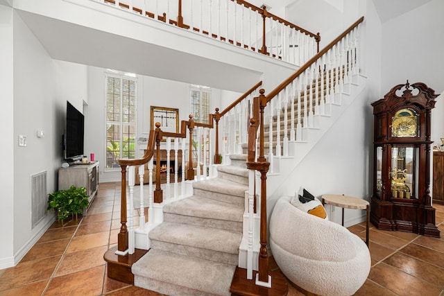 12927 Finch Brook Dr, Cypress, TX 77429 - staircase with baseboards and a towering ceiling