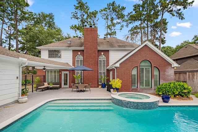 12927 Finch Brook Dr, Cypress, TX 77429 - rear view of house featuring a chimney, a patio area, brick siding, and ceiling fan