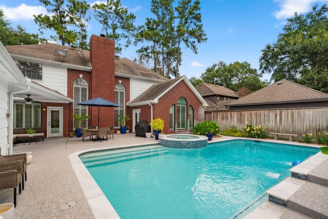 12927 Finch Brook Dr, Cypress, TX 77429 - view of swimming pool featuring a patio, a ceiling fan, and a pool with connected hot tub