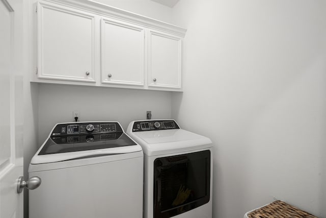 12927 Finch Brook Dr, Cypress, TX 77429 - laundry area featuring washing machine and dryer and cabinet space