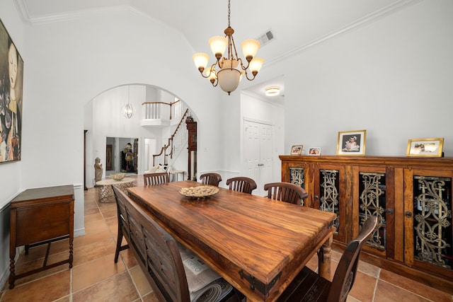 12927 Finch Brook Dr, Cypress, TX 77429 - dining space featuring arched walkways, a chandelier, vaulted ceiling, ornamental molding, and stairs