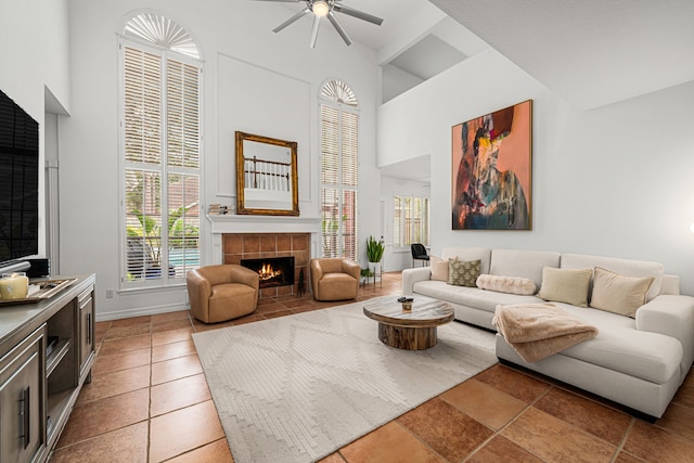 12927 Finch Brook Dr, Cypress, TX 77429 - living room with high vaulted ceiling, a tiled fireplace, and ceiling fan