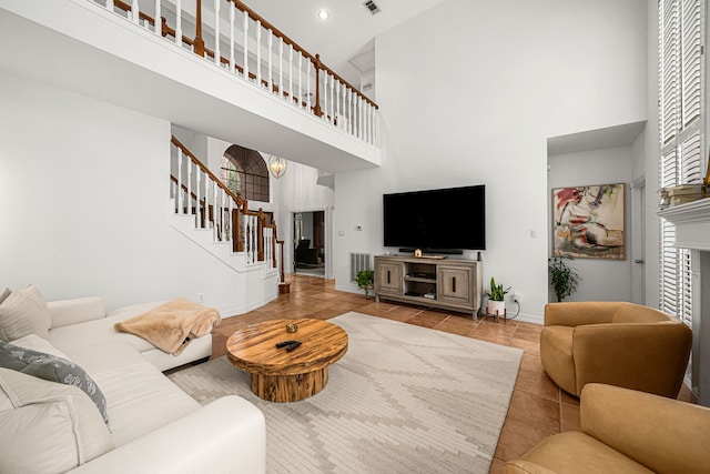 12927 Finch Brook Dr, Cypress, TX 77429 - tiled living room featuring high vaulted ceiling and stairway