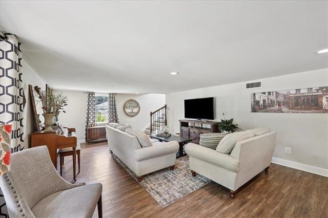 3231 Charles Ave, Groves, TX 77619 - living area with wood finished floors, recessed lighting, and stairs