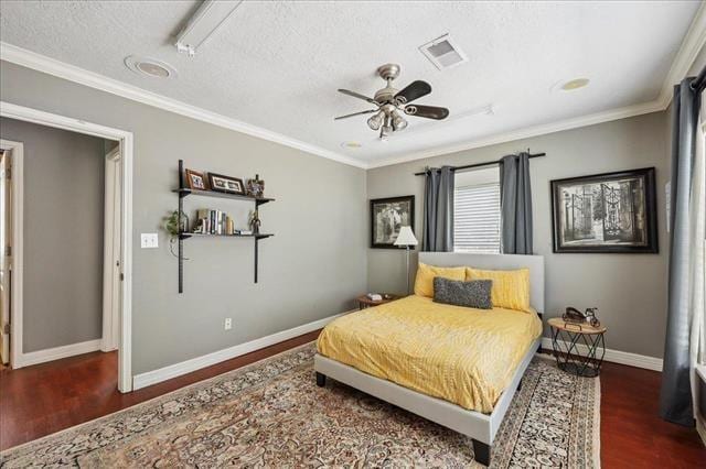 3231 Charles Ave, Groves, TX 77619 - bedroom featuring wood finished floors, crown molding, ceiling fan, and a textured ceiling