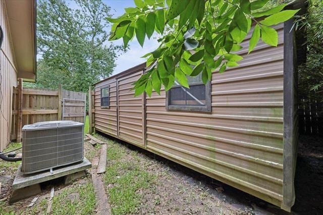 3231 Charles Ave, Groves, TX 77619 - view of side of home featuring a central AC unit