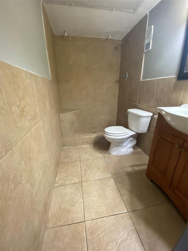 12955 Woodforest Blvd Unit 3, Houston, TX 77015 - full bath featuring tile walls, a tile shower, vanity, and tile patterned flooring