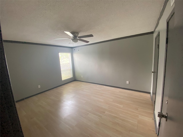 12955 Woodforest Blvd Unit 3, Houston, TX 77015 - unfurnished room featuring light wood-style floors, a ceiling fan, crown molding, and a textured ceiling
