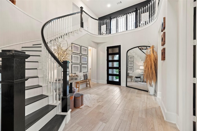19011 Festival Hill Ct, Cypress, TX 77433 - entryway with stairway, a high ceiling, wood finished floors, and recessed lighting