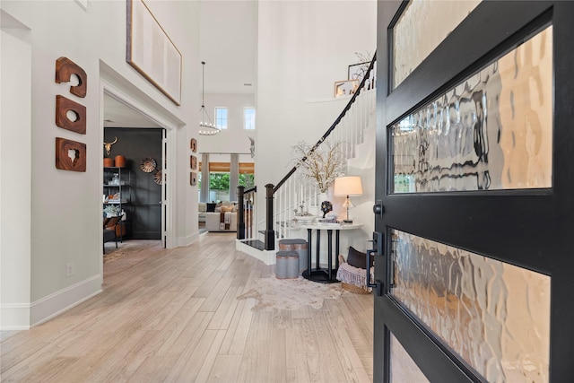 19011 Festival Hill Ct, Cypress, TX 77433 - foyer entrance with stairway, wood finished floors, and a high ceiling
