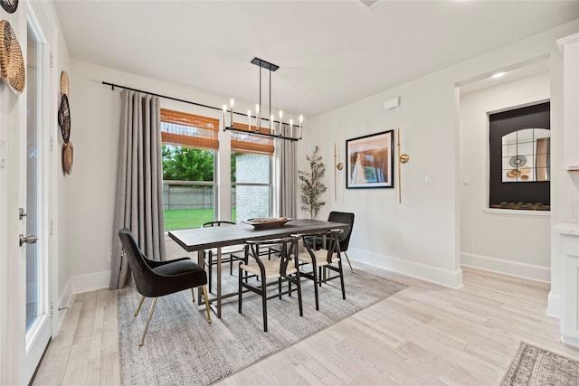 19011 Festival Hill Ct, Cypress, TX 77433 - dining room with light wood finished floors and a chandelier